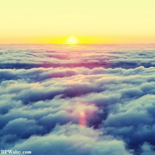 a sunset over the clouds