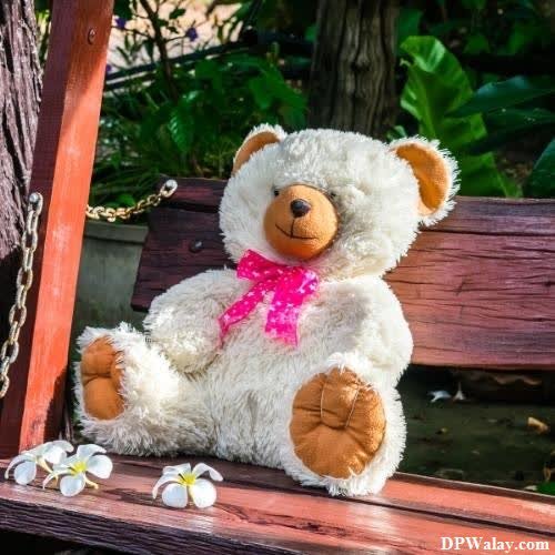 cute whatsapp dp - a teddy bear sitting on a wooden bench