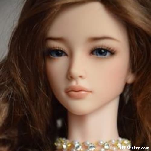 a doll with long hair and a necklace
