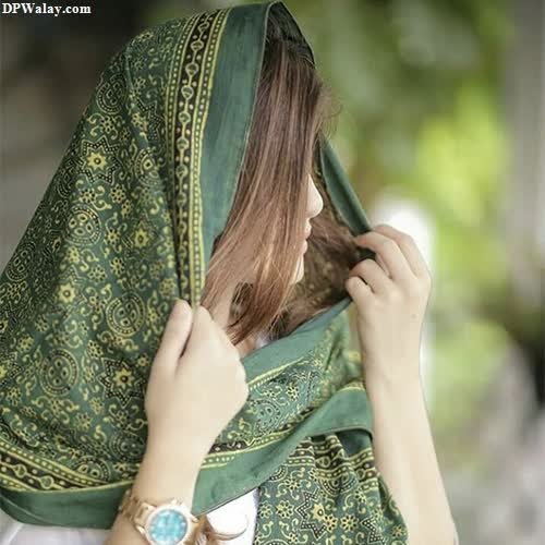 a woman wearing a green scarf best photo for whatsapp dp