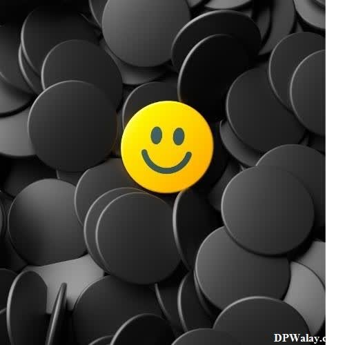 a smiley face surrounded by black circles 