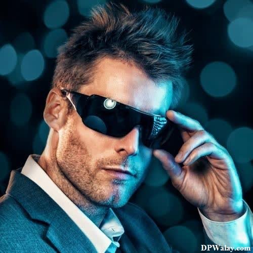 cool whatsapp dp - a man in a suit and sunglasses with a cell