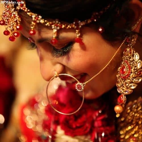 a bride in a red and gold outfit