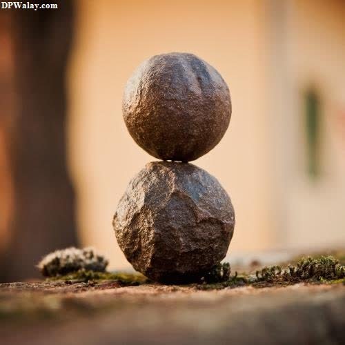 a stone balancing on top of a rock best wallpapers for whatsapp dp 