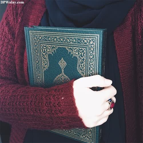 a woman holding a book in her hands 