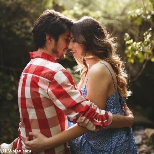 couple dp for whatsapp - a couple in the woods hugging
