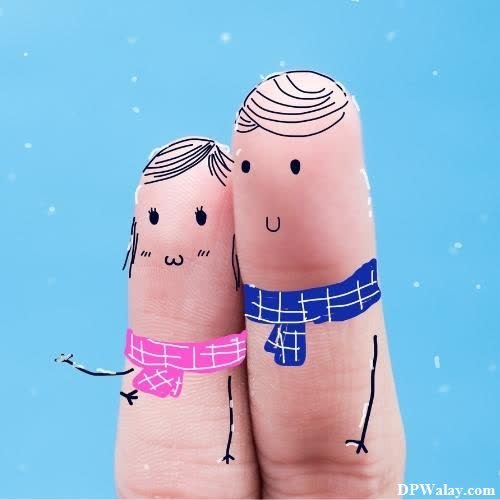 a couple holding hands in the snow