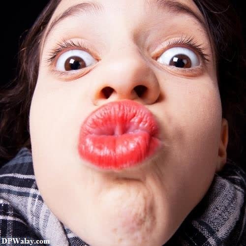 funny whatsapp dp - a young girl sticking her tongue out