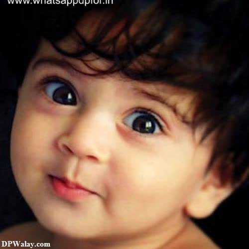 whatsapp dp cute baby girl - a baby with a big blue eyes
