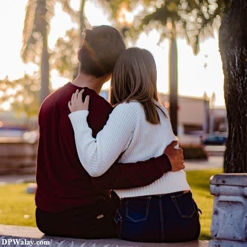 a couple sitting on a bench in the park cute couple dp for whatsapp