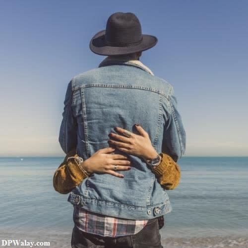 a man in a hat and jeans jacket standing on the beach cute couple dp for whatsapp 