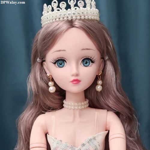 a doll with long hair wearing a tia