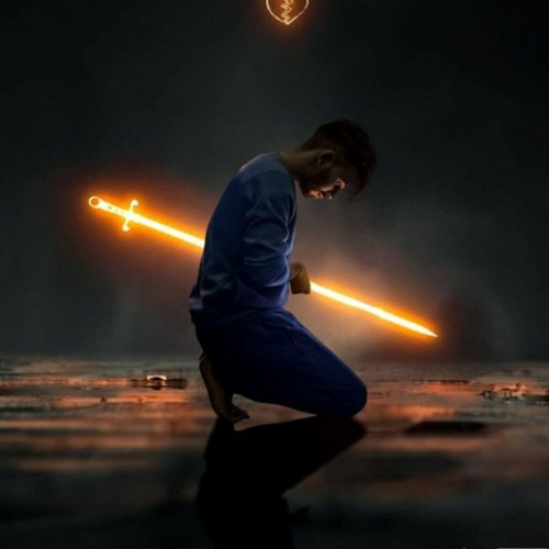 a man kneeling on the ground with a light saber dp for whatsapp boys 