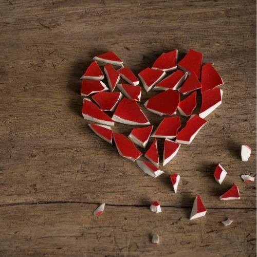 broken heart on a wooden background