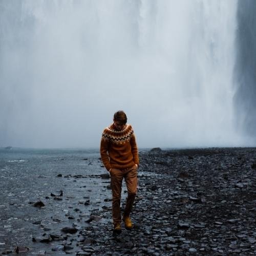 a man standing in front of a waterfall dp for whatsapp sad