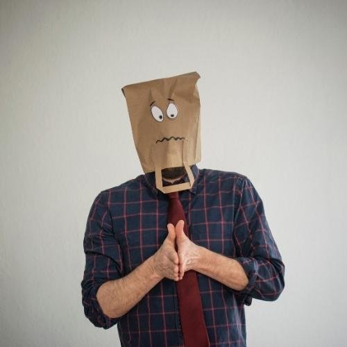 a man wearing a paper bag over his head dp for whatsapp sad
