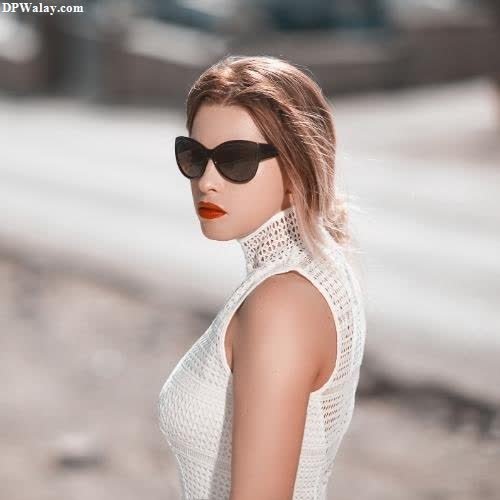 a woman wearing sunglasses and a white dress dp pic whatsapp