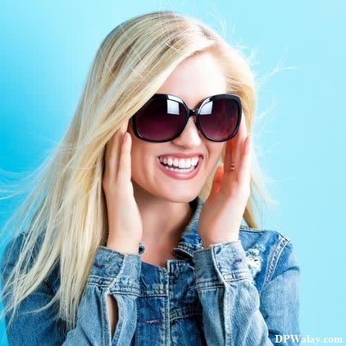 a woman wearing sunglasses and smiling dp whatsapp photo