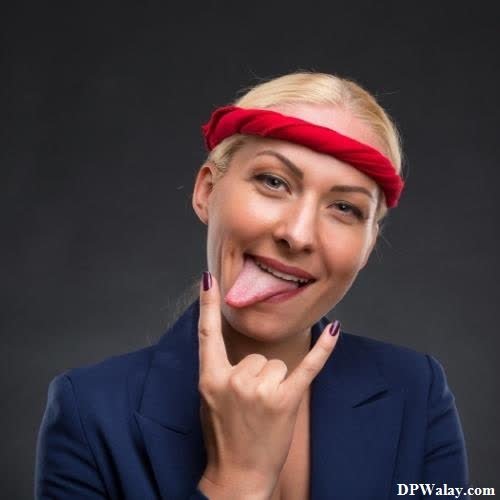 a woman with a red headband sticking her tongue funny dp 