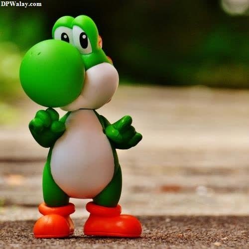 a toy with a green and white face funny meme dp