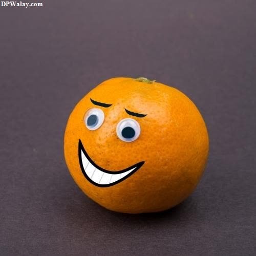 an orange with a smiley face on it 