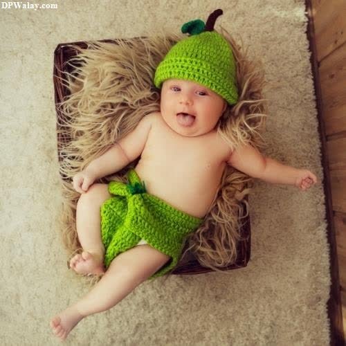 a baby wearing a green hat and diaper funny pics for dp 