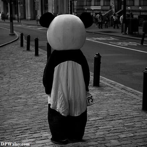 a person in a panda suit walking down the street