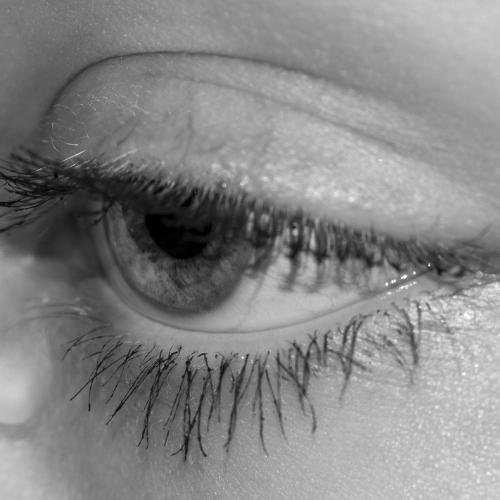 sad whatsapp dp - a woman's eye with long eyelashes