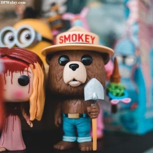 a couple of toys are standing next to each other figures nice cute whatsapp dp