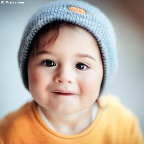a baby wearing a blue knitted hat images by DPwalay