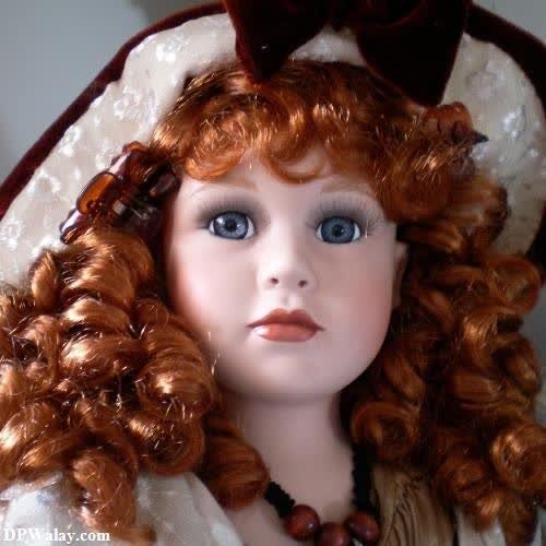 a doll with red hair and a white dress