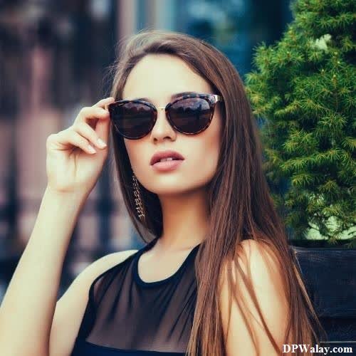 a woman wearing sunglasses and a black dress profile pictures whatsapp dp images
