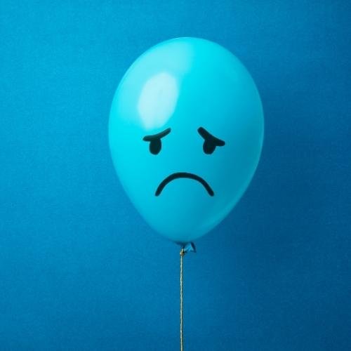 a balloon with a sad face on it images by DPwalay