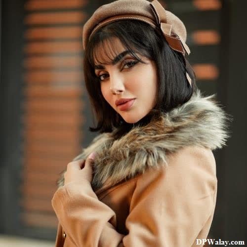 a woman in a brown coat and hat stylish girl dp for whatsapp 