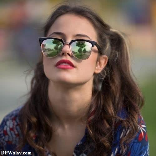a woman wearing sunglasses and looking up at the sky stylish girl dp for whatsapp 