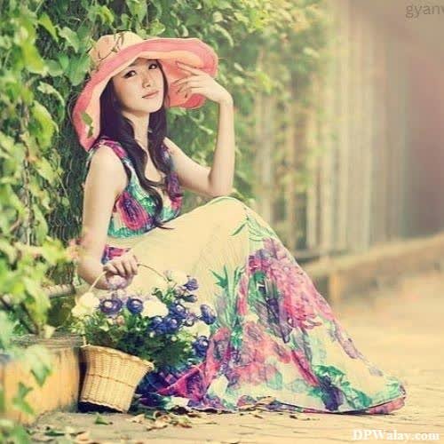 a woman sitting on the ground with a basket of flowers stylish girls whatsapp dp