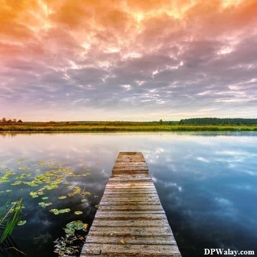 wallpaper for whatsapp dp - a wooden dock in the middle of a lake