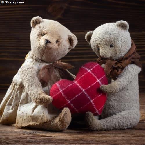 two teddy bears holding a heart whatsapp dp cute