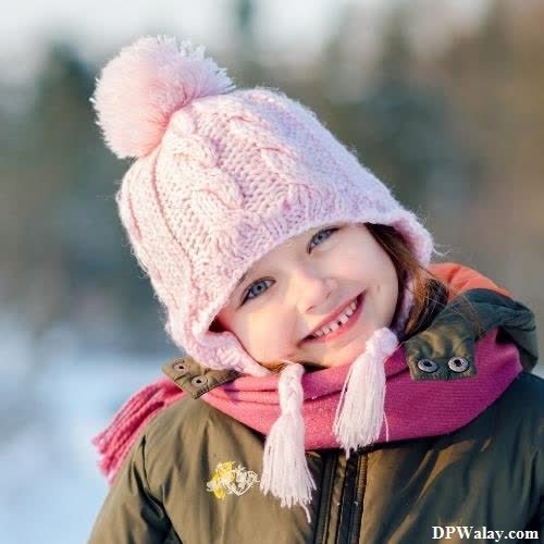 a little girl in a pink hat and scarf whatsapp dp cuteness cute baby girl 