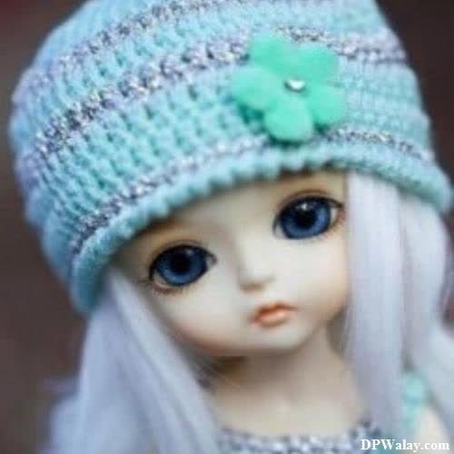 unique dp for whatsapp - a doll wearing a blue hat with a green flower