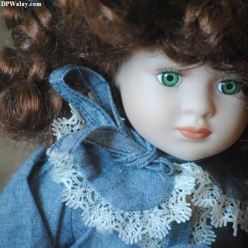 a doll with curly hair and green eyes