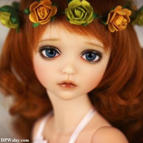 a doll with red hair and flowers in her hair