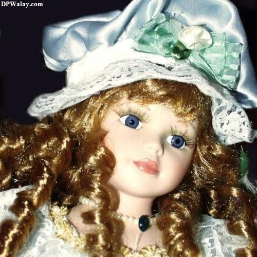 dp pic - a doll with a white hat and green bow