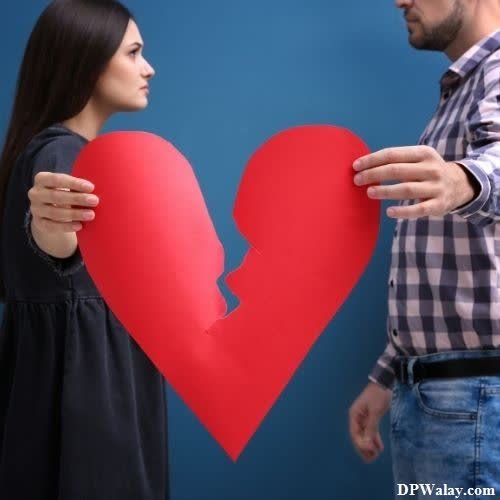 a man and woman holding a red heart breakup dp for whatsapp