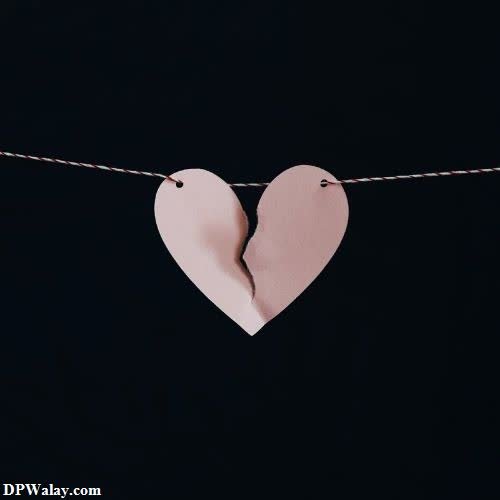 a heart hanging on a clothes line
