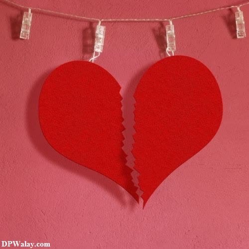 a broken heart hanging on a string breakup whatsapp dp 