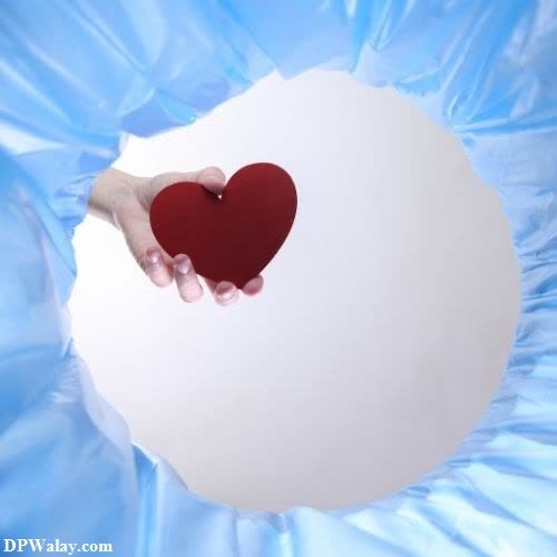 a heart in a blue plastic bag broken heart sad dp 