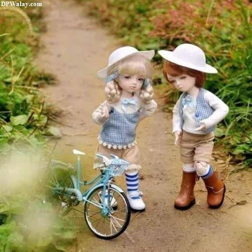 two dolls are standing next to each other dolls cartoon images whatsapp dp 