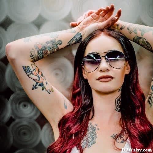 a woman with tattoos on her arms and arms-Sj3j