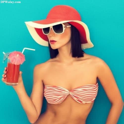 a woman in a bikini and hat holding a drink cool hot status 